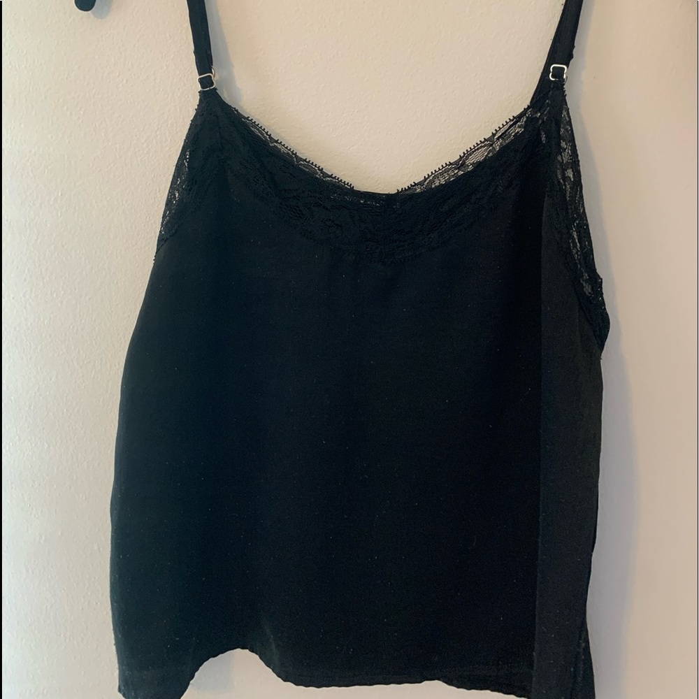 Brandy Melville black tank top with lace. Lightly worn. Adjustable straps.